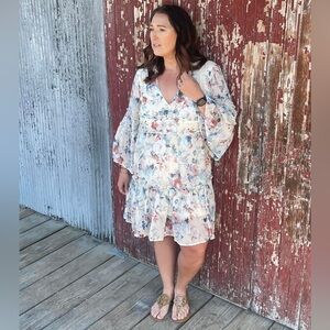 A beautifully romantic floral dress by Sweet Lemon. Size Small